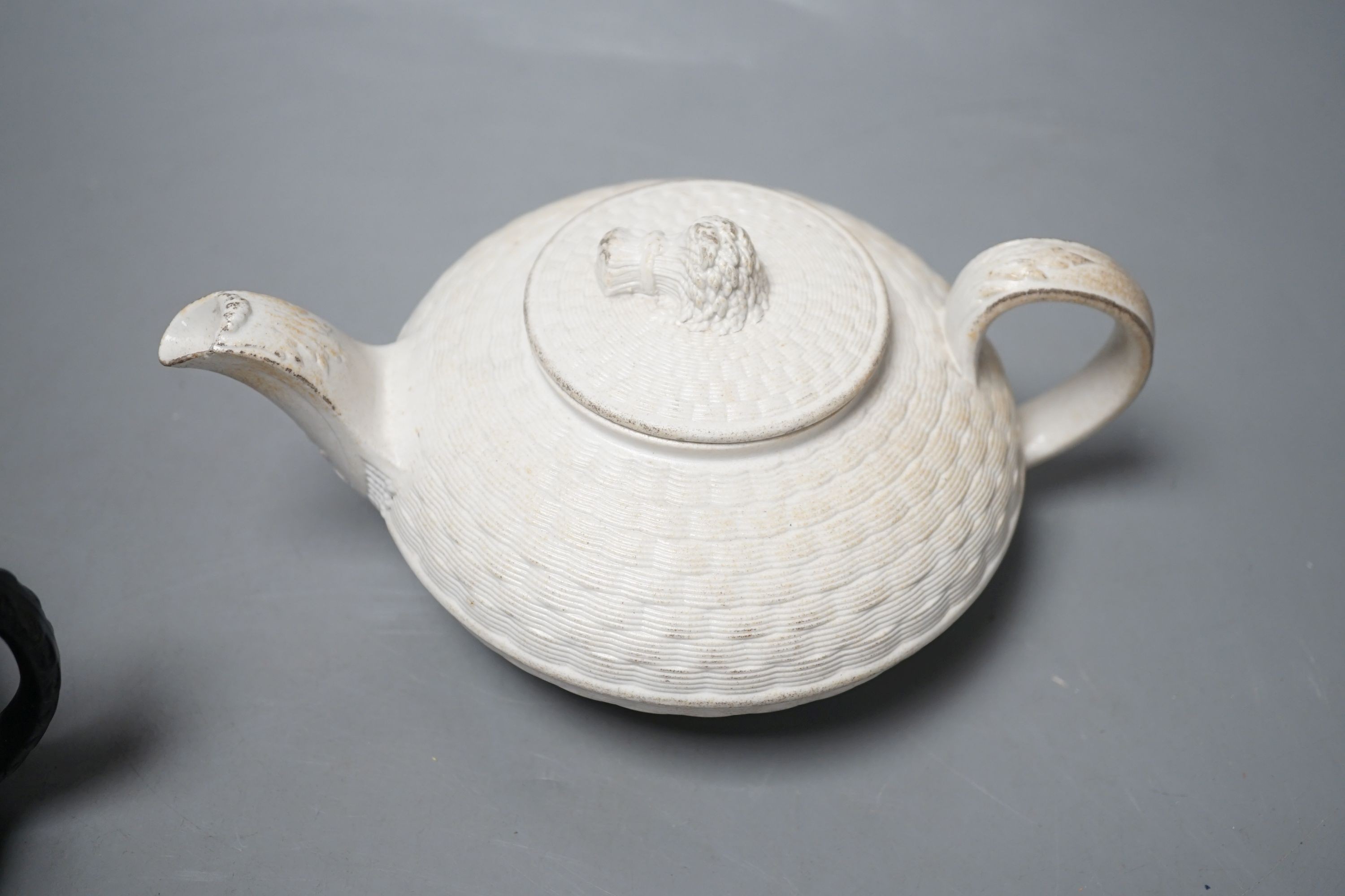 A Wedgwood caneware teapot c.1810 and an English black basalt teapot c.1810